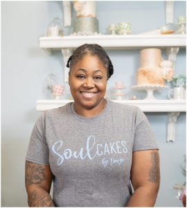 Woman dressed in a t-shirt that reads Soul Cakes by Tanya.