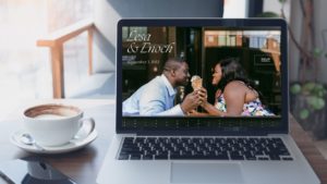 computer screens shows mockup of a wedding website featuring an African American couple.